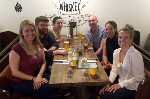 The ANU Team welcoming Amy over beers.
