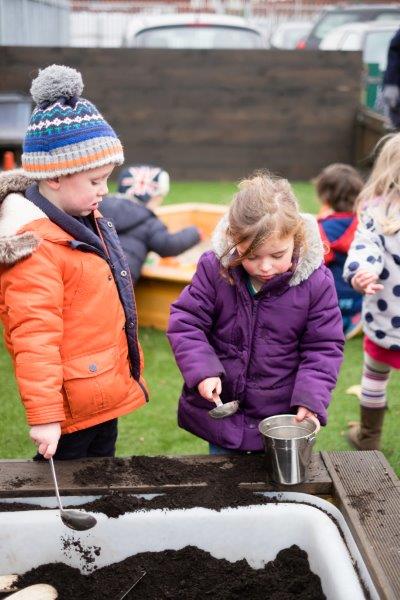 Children playing with soil