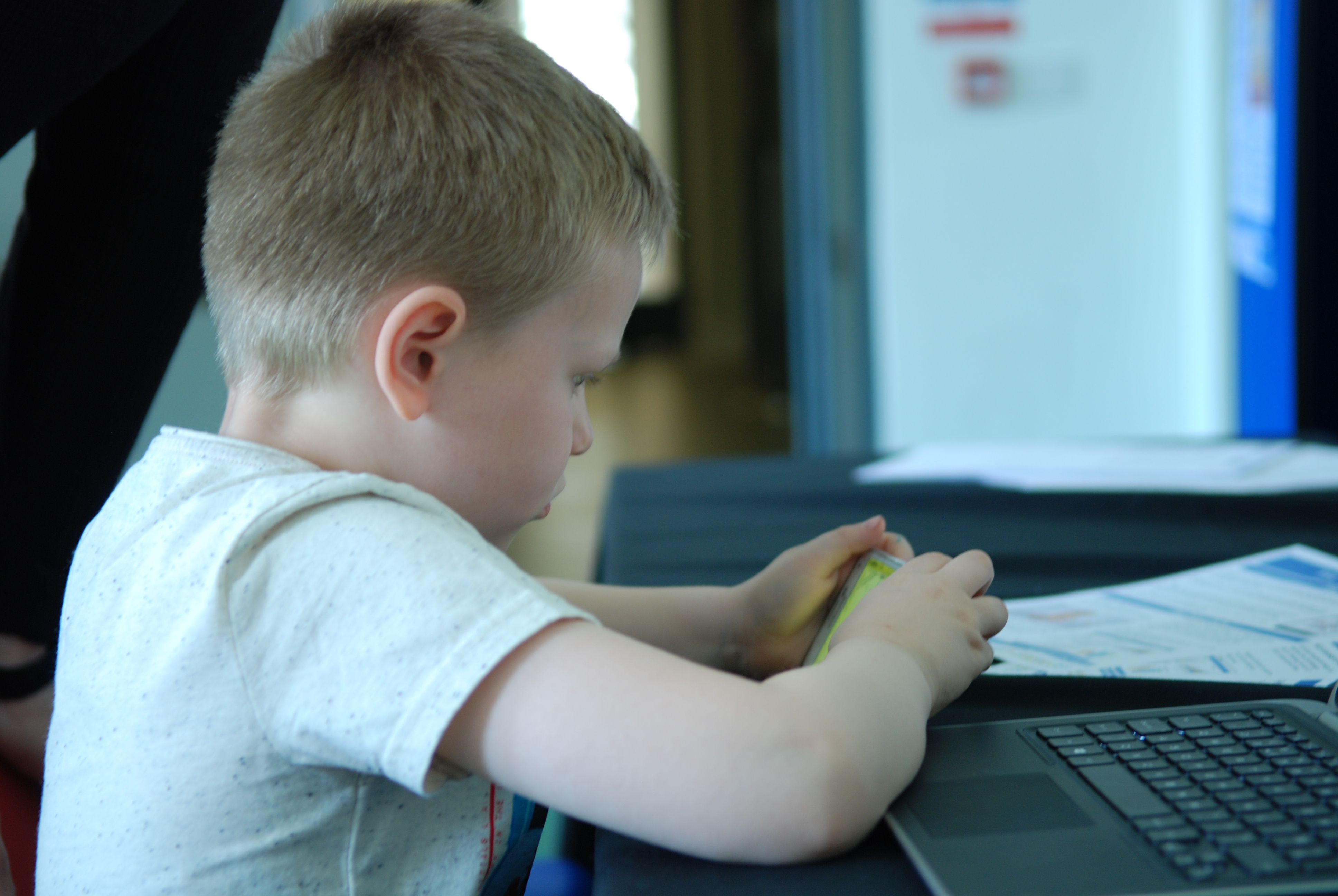 Boy plays on mobile  app