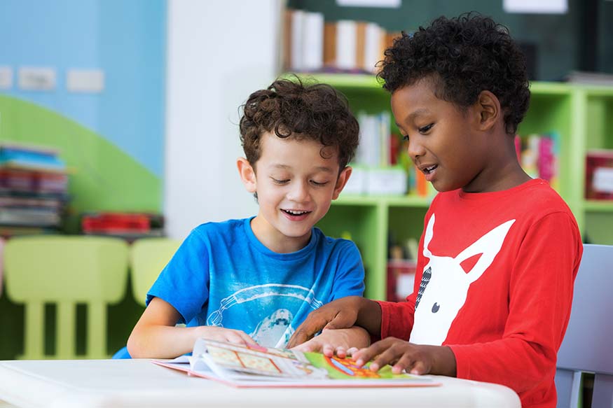 Two boys talking about an exercise they are completing.