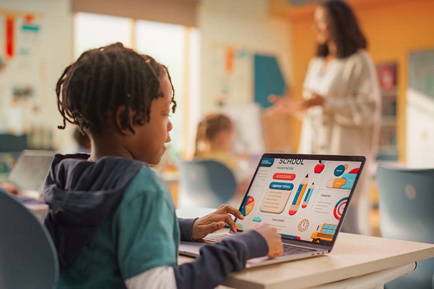 A child using a computer in a lesson.